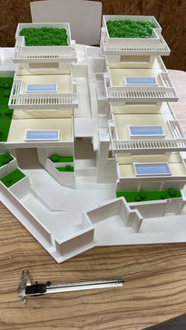 Architectural scale model checked with a caliper for dimensional accuracy — Eolas Prints