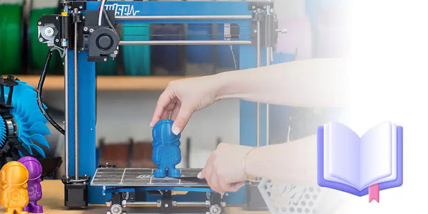 Hand adjusting 3D print on build platform of Eolas Prints FDM printer