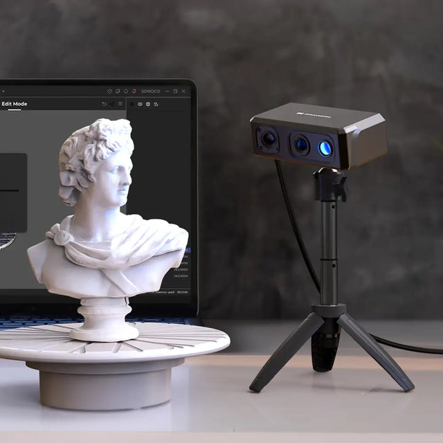 3DMakerpro Seal Lite 3D scanner with gray body and blue lenses on tripod