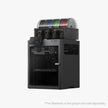 Bambu Lab X2D black 3D printer with transparent filament storage holding colorful spools for efficient printing