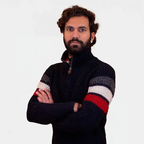 Black knit sweater with red, white and grey striped sleeves.