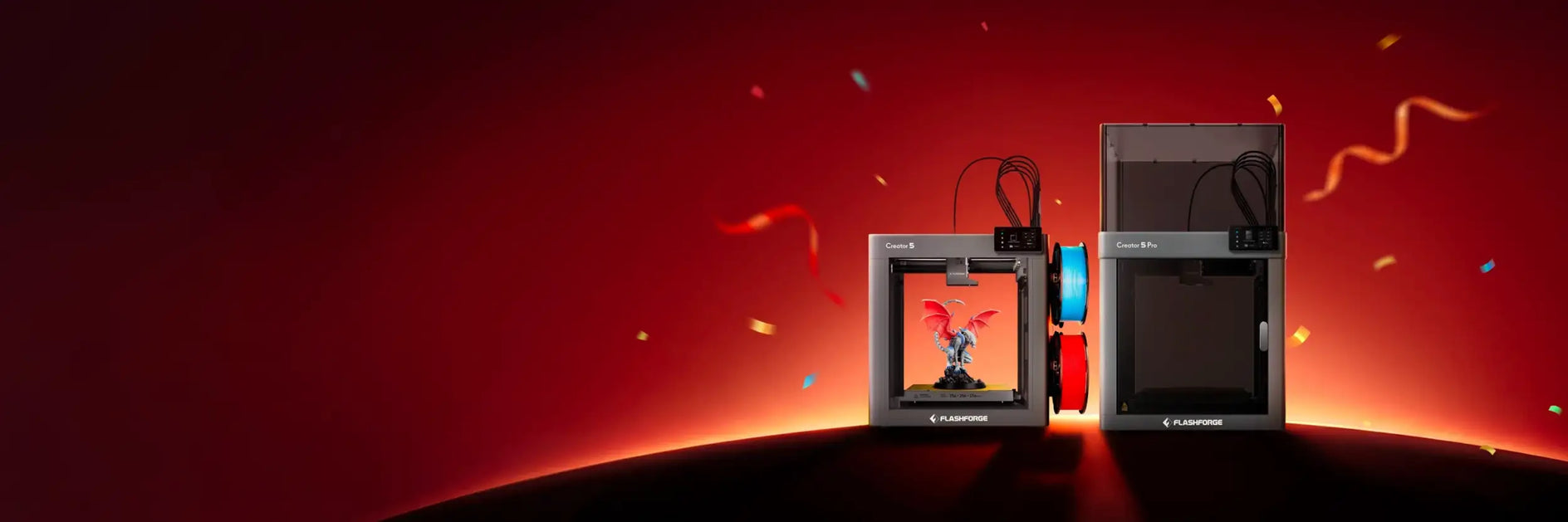 Black and silver flashforge 3d printers with a red dragon figurine inside one of the machines.