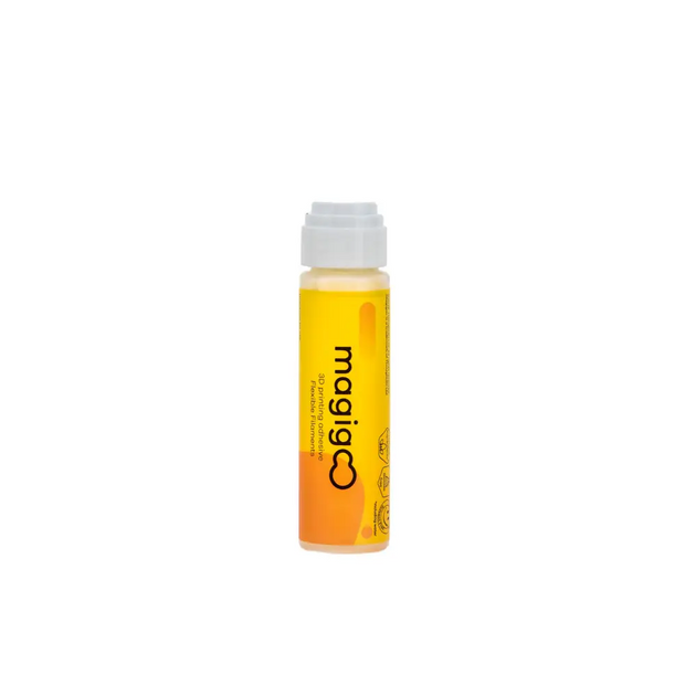 Clear bottle containing orange-yellow liquid with ’magic’ text visible on its side.