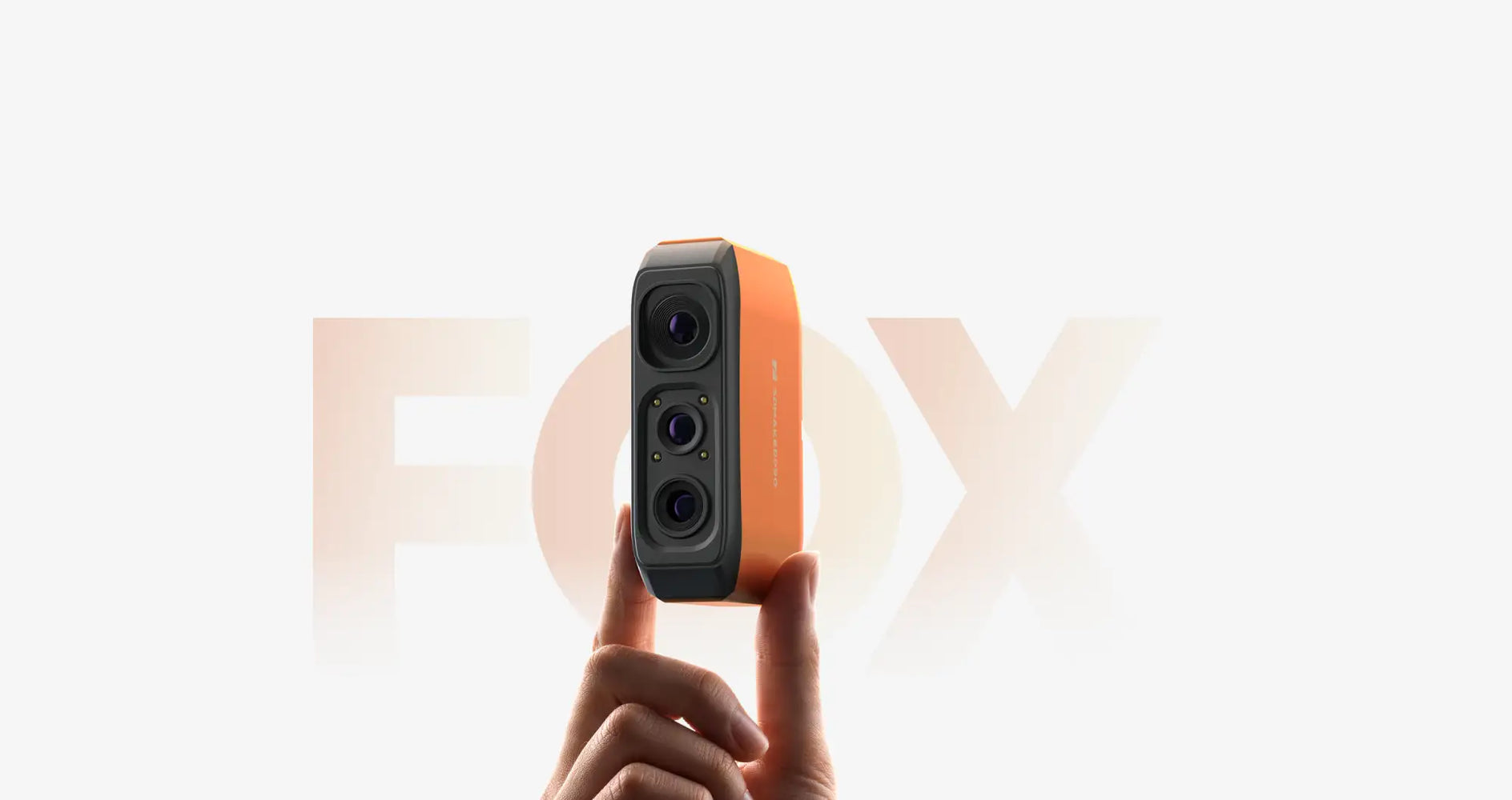 Orange and black fox 3d camera with three lenses.