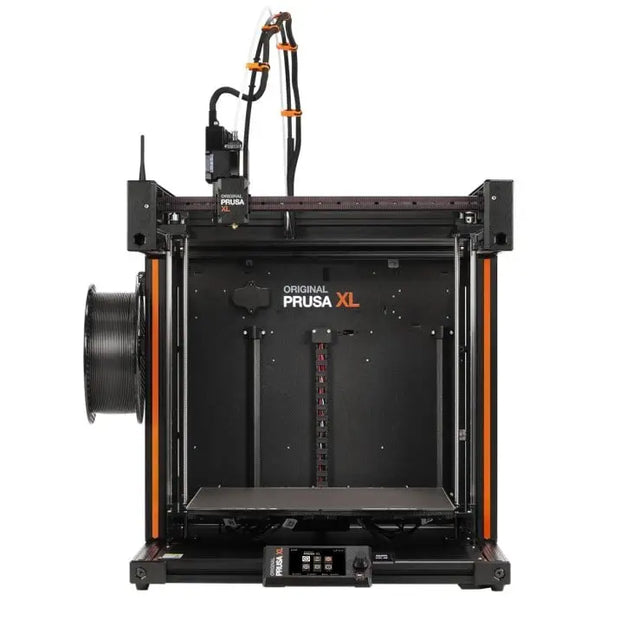 3D printer with an open frame design and orange accents, labeled ’PRUSA XL’.