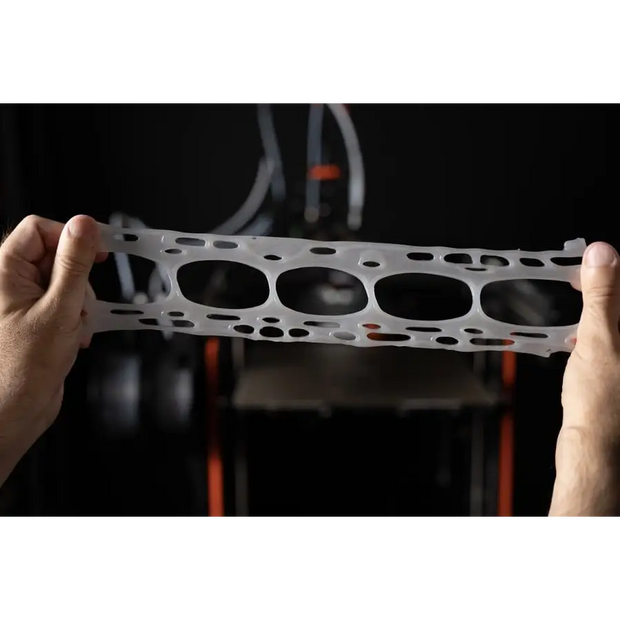 Silver metallic gear belt loop on Original Prusa silicone printing toolhead