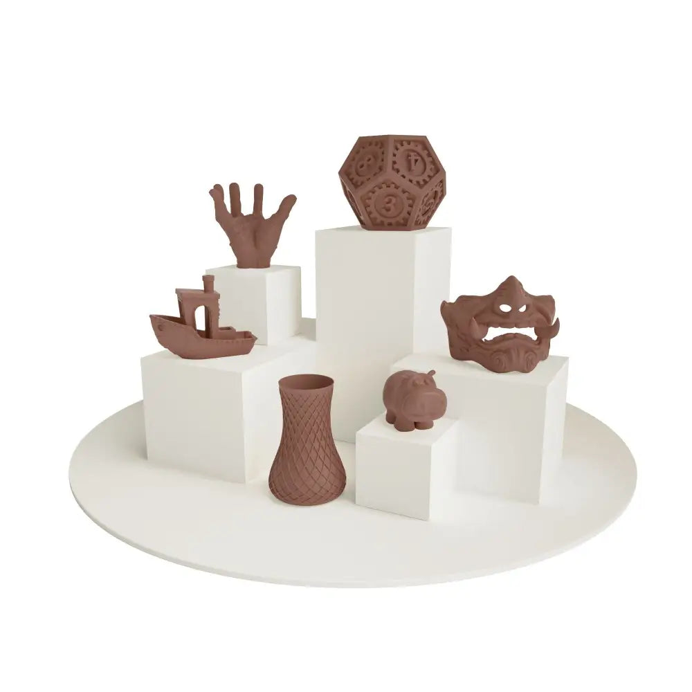 Brown PLA filament 1.75 mm prints of ceramic figurines on pedestals