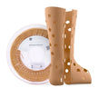Tan PLA filament 1.75mm spool with orthopedic boot model and food contact casing