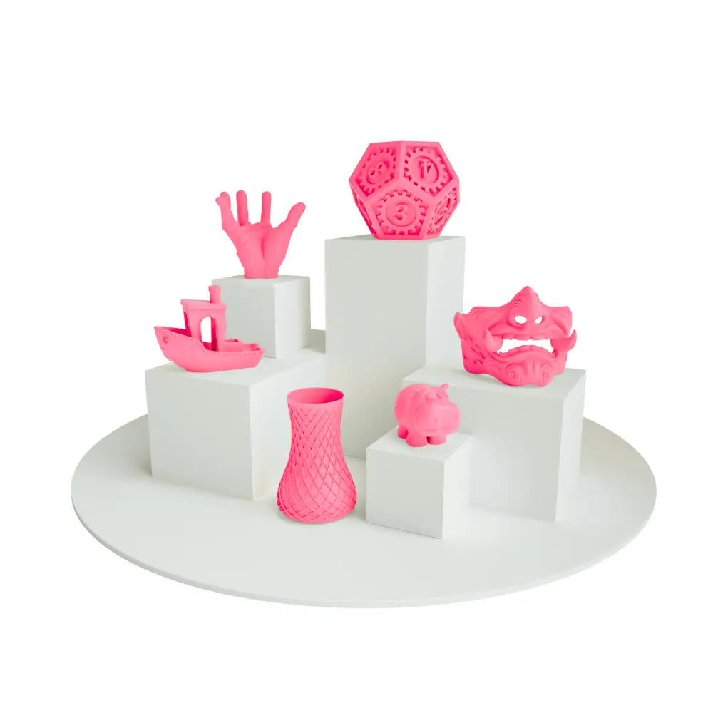 3D printed pink vase in PLA neon filament with intricate lattice design