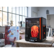 Black and orange 3D printer with transparent enclosure.