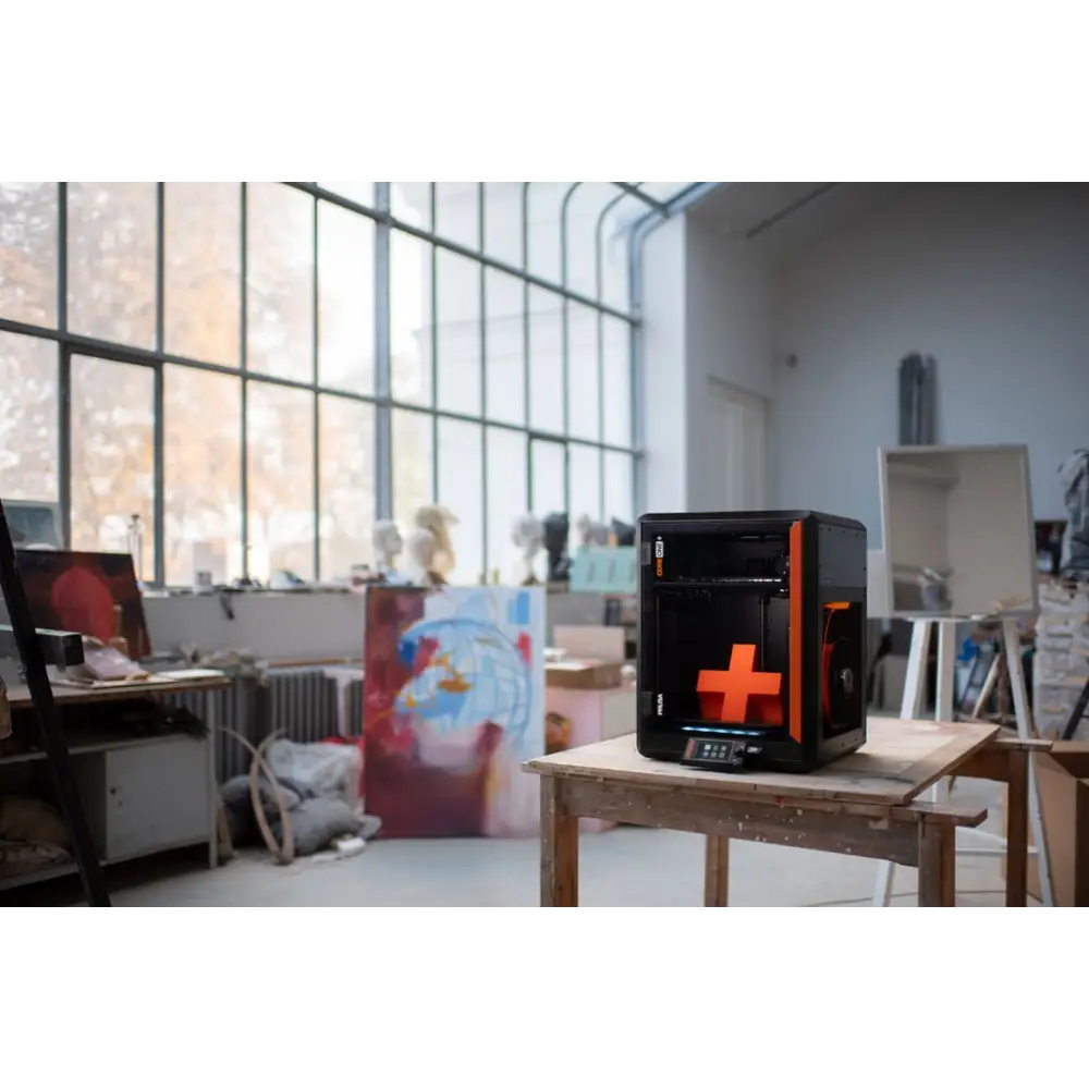 Prusa Core One Plus+ 3D printer with orange black accents and E3D V6 compatibility