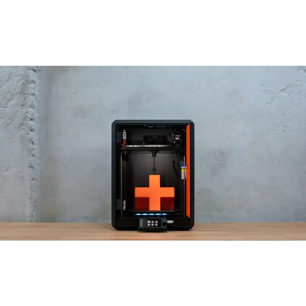 Prusa Core One Plus 3D printer with orange-black design and plus sign print