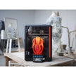 Black and orange 3D printer with transparent enclosure.