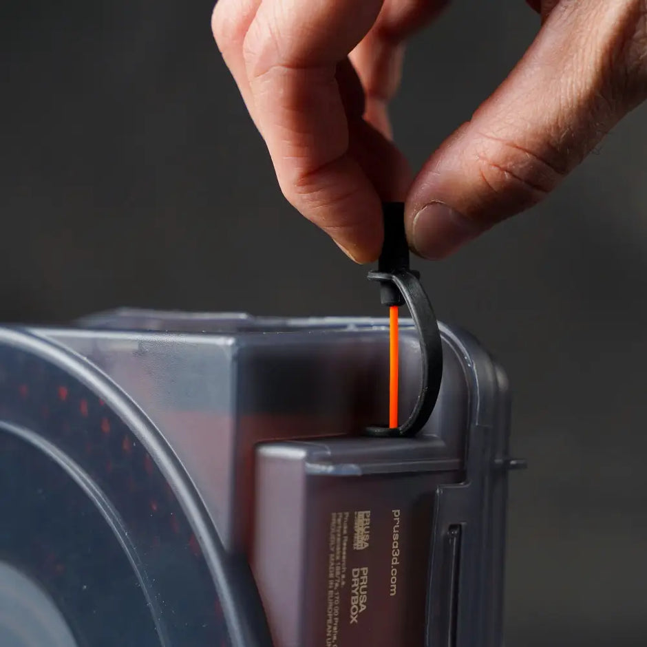 Black and orange retractable tape measure in Prusa USS Drybox